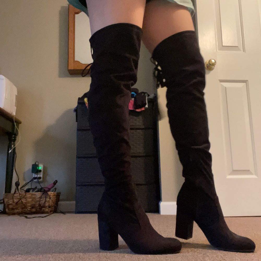 Black knee high heeled boots